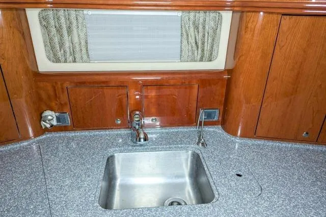 Tigress Yacht Photos Pics Luxury kitchen sink area in 2002 Sea Ray 550 Sundancer yacht.