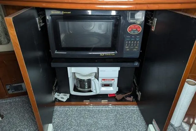 Tigress Yacht Photos Pics Microwave and coffee maker in 2002 Sea Ray 550 Sundancer yacht kitchen cabinet.