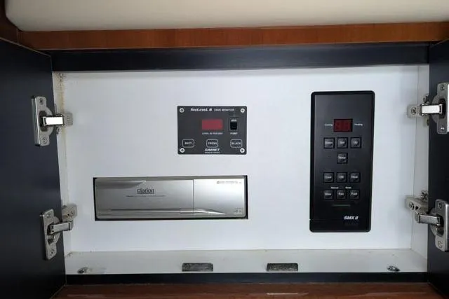 Tigress Yacht Photos Pics Control panel inside a 2002 Sea Ray 550 Sundancer yacht cabinet.