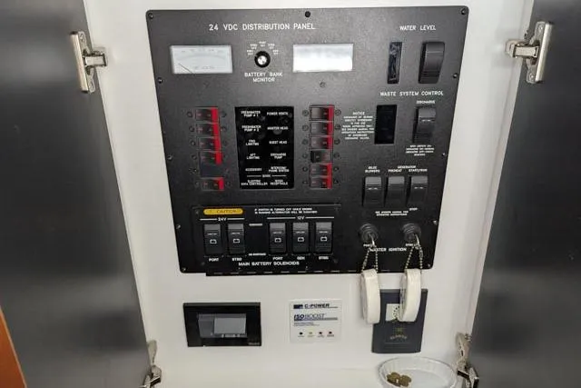 Tigress Yacht Photos Pics Control panel of a 2002 Sea Ray 550 Sundancer yacht, featuring various switches and indicators.
