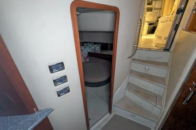 Tigress Yacht Photos Pics Interior view of 2002 Sea Ray 550 Sundancer yacht with stairs and cabin entrance.