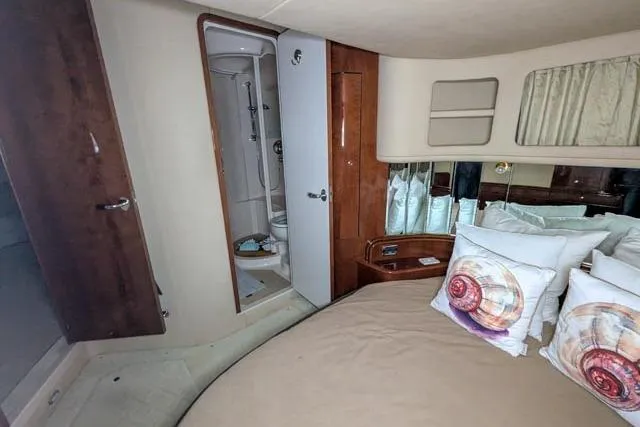 Tigress Yacht Photos Pics Luxurious 2002 Sea Ray 550 Sundancer cabin with ensuite bathroom and stylish decor.