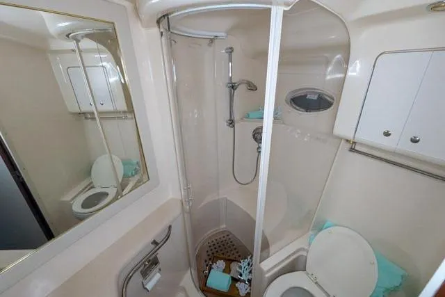 Tigress Yacht Photos Pics Luxurious bathroom in 2002 Sea Ray 550 Sundancer yacht with shower and toilet.