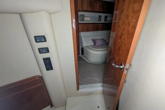 Tigress Yacht Photos Pics Interior view of 2002 Sea Ray 550 Sundancer yacht cabin with wood accents and seating.