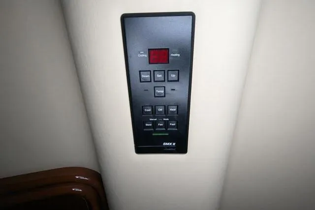 Tigress Yacht Photos Pics Control panel on 2002 Sea Ray 550 Sundancer yacht, featuring various buttons and display.
