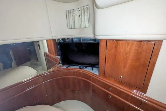 Tigress Yacht Photos Pics Luxurious 2002 Sea Ray 550 Sundancer cabin with elegant wood cabinetry and modern amenities.