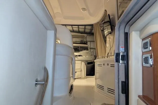 Tigress Yacht Photos Pics Interior view of 2002 Sea Ray 550 Sundancer yacht, featuring luxurious seating and modern amenities.