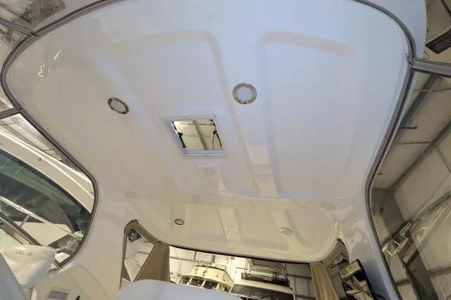 Tigress Yacht Photos Pics Interior ceiling of a 2002 Sea Ray 550 Sundancer yacht, featuring sleek design and lighting.