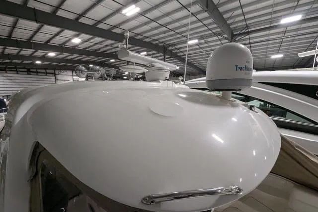 Tigress Yacht Photos Pics 2002 Sea Ray 550 Sundancer yacht in a covered marina, featuring radar equipment.