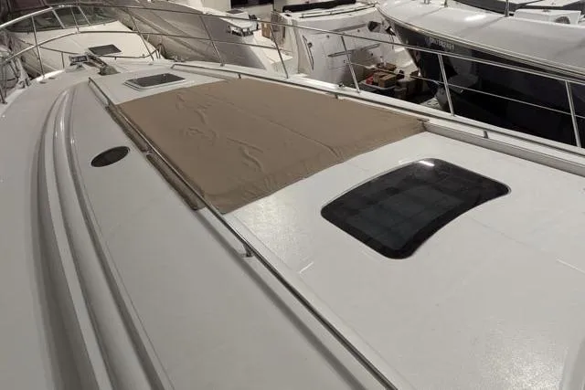 Tigress Yacht Photos Pics 2002 Sea Ray 550 Sundancer yacht deck with sunpad and hatches.