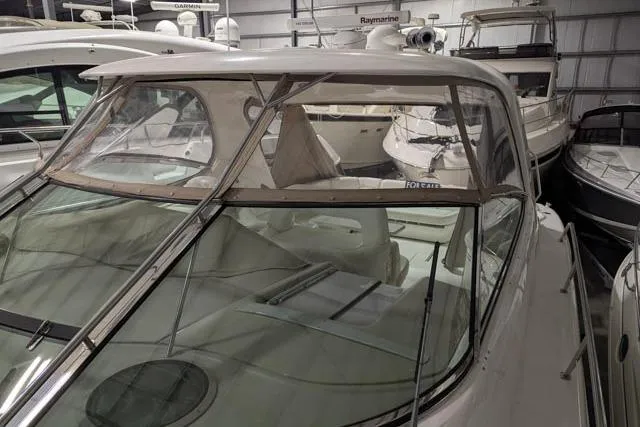 Tigress Yacht Photos Pics 2002 Sea Ray 550 Sundancer yacht in storage, featuring sleek design and spacious cockpit.