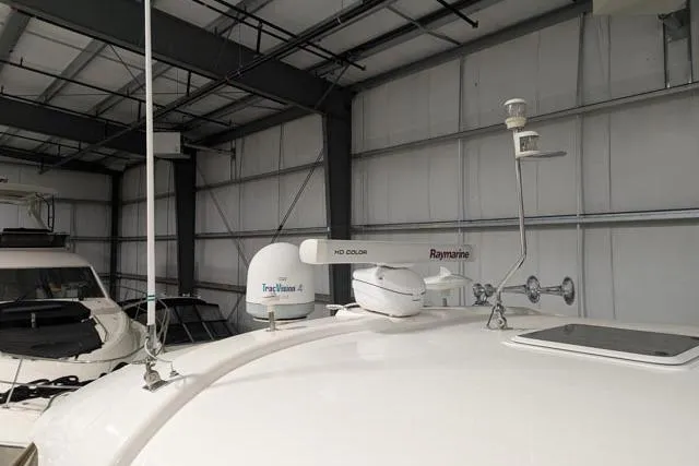 Tigress Yacht Photos Pics 2002 Sea Ray 550 Sundancer yacht in storage, featuring advanced navigation equipment.