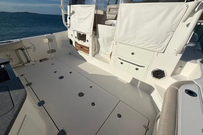  Yacht Photos Pics Boston Whaler 405 Conquest 2022 boat deck with storage compartments and ocean view.