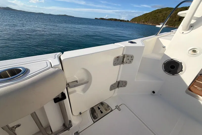  Yacht Photos Pics Boston Whaler 405 Conquest 2022 boat deck with ocean view and island backdrop.
