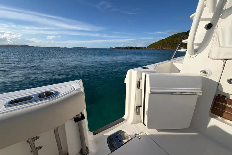  Yacht Photos Pics Boston Whaler 405 Conquest 2022 yacht with open deck, overlooking serene ocean and island.
