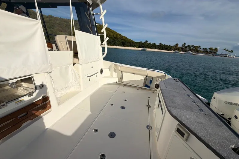  Yacht Photos Pics 2022 Boston Whaler 405 Conquest boat deck with ocean and island view.