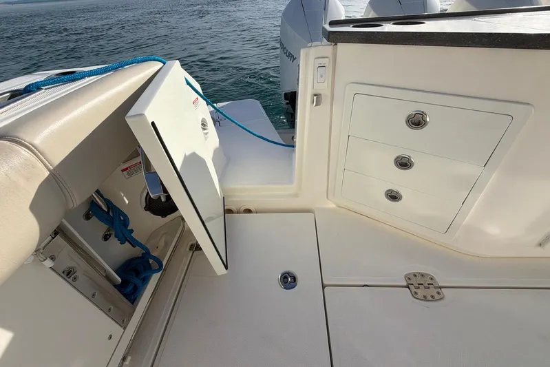  Yacht Photos Pics 2022 Boston Whaler 405 Conquest boat deck with storage compartments and ocean view.