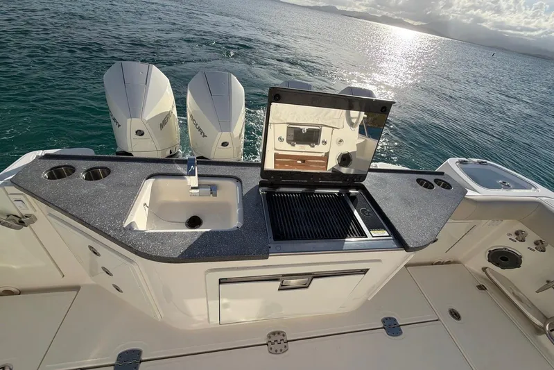  Yacht Photos Pics Boston Whaler 405 Conquest 2022 boat with outdoor kitchen and twin Mercury engines.