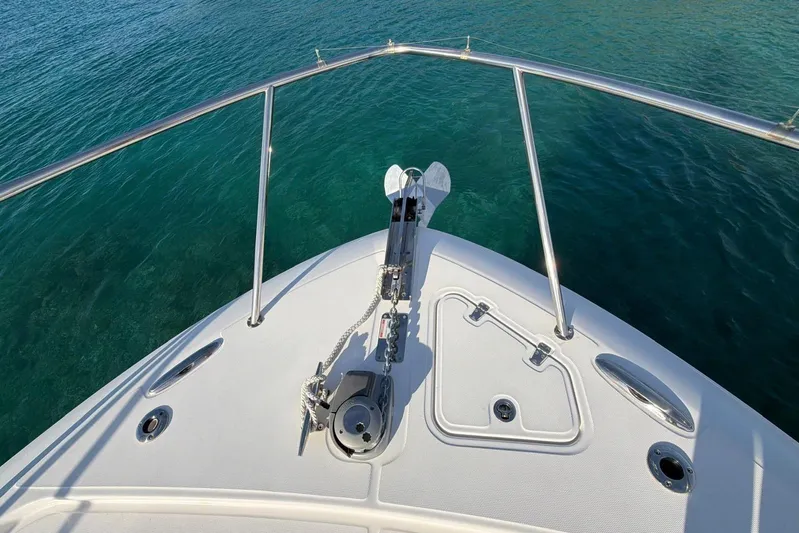  Yacht Photos Pics Bow view of 2022 Boston Whaler 405 Conquest on clear water.