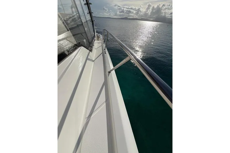  Yacht Photos Pics Boston Whaler 405 Conquest 2022 yacht deck with ocean view and sunlight reflections.