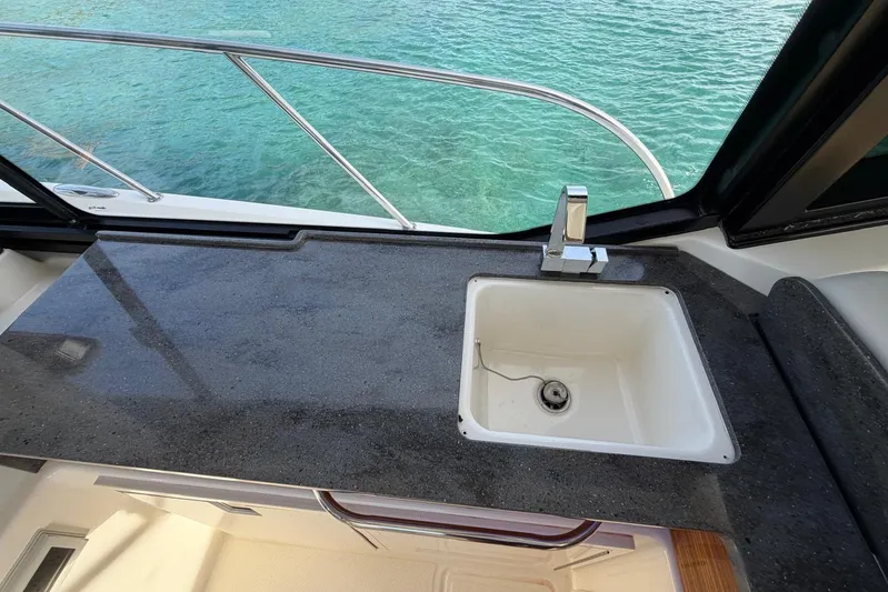  Yacht Photos Pics Boston Whaler 405 Conquest 2022 boat sink with granite countertop and ocean view.