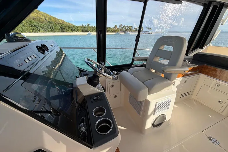  Yacht Photos Pics Interior view of 2022 Boston Whaler 405 Conquest boat helm with ocean backdrop.