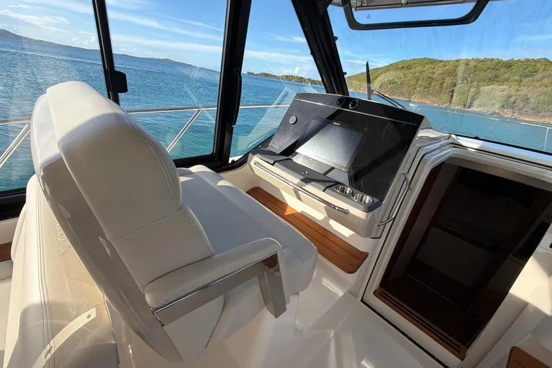  Yacht Photos Pics 2022 Boston Whaler 405 Conquest helm with luxurious seating and ocean view.