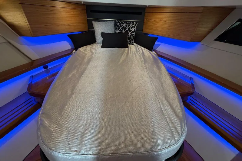  Yacht Photos Pics Luxurious cabin interior of 2022 Boston Whaler 405 Conquest with ambient blue lighting.