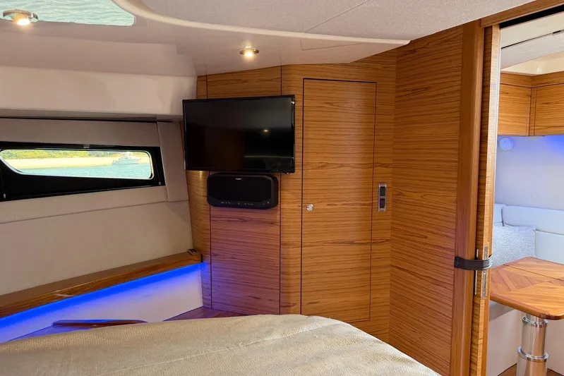  Yacht Photos Pics Luxurious interior of 2022 Boston Whaler 405 Conquest with wood paneling and modern amenities.