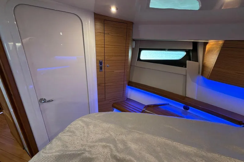  Yacht Photos Pics Luxurious interior of 2022 Boston Whaler 405 Conquest with modern wood finish and ambient lighting.