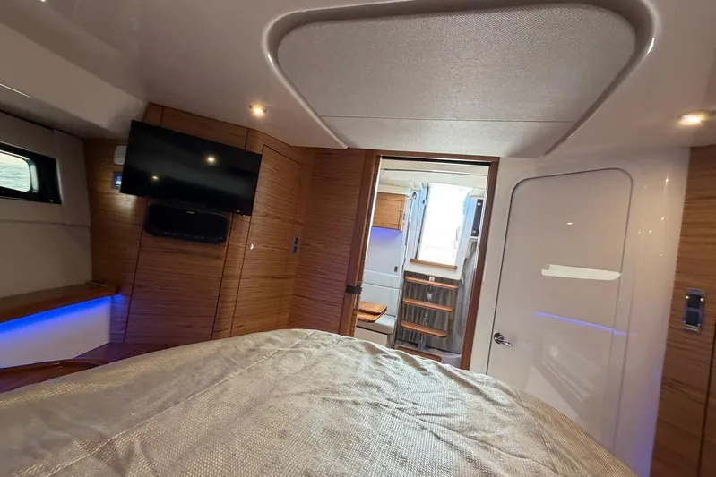  Yacht Photos Pics Luxurious interior of 2022 Boston Whaler 405 Conquest yacht cabin with TV and modern design.