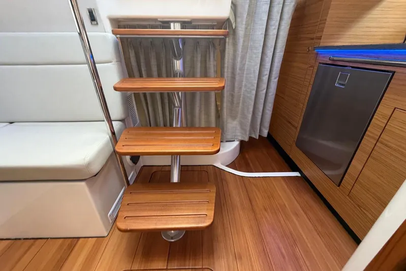  Yacht Photos Pics Interior of 2022 Boston Whaler 405 Conquest with wooden steps and modern design.