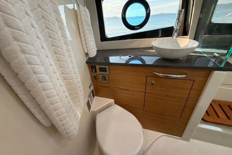 Yacht Photos Pics Luxurious bathroom interior of 2022 Boston Whaler 405 Conquest yacht with ocean view.