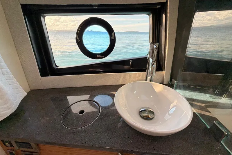  Yacht Photos Pics Luxurious bathroom interior of 2022 Boston Whaler 405 Conquest yacht with ocean view.