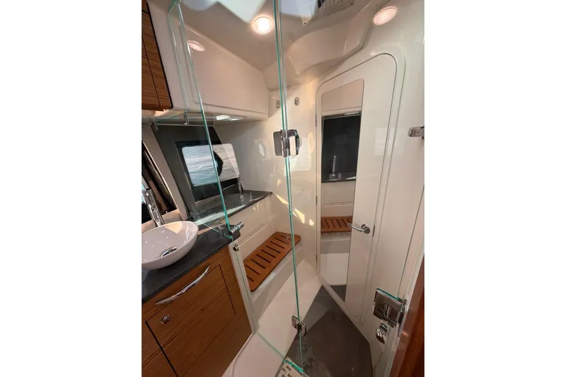  Yacht Photos Pics Luxurious bathroom interior of 2022 Boston Whaler 405 Conquest yacht with modern fixtures.