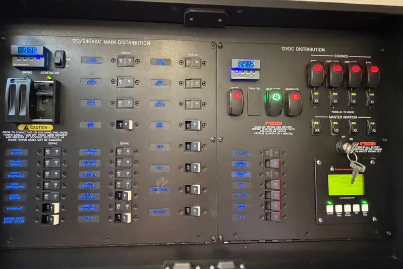  Yacht Photos Pics Electrical control panel of 2022 Boston Whaler 405 Conquest boat, showing switches and meters.