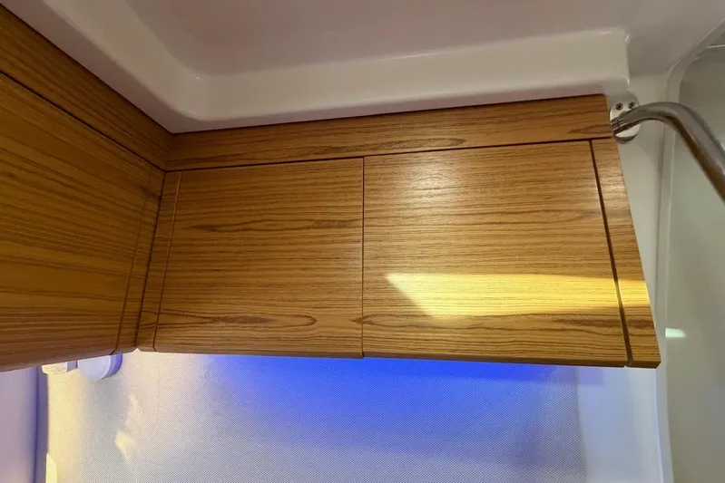  Yacht Photos Pics Wooden cabinetry detail inside 2022 Boston Whaler 405 Conquest boat.