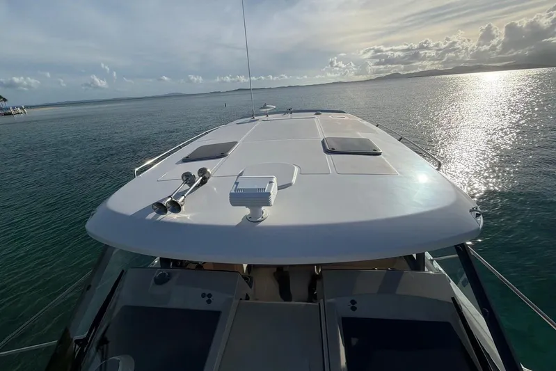  Yacht Photos Pics Boston Whaler 405 Conquest 2022 yacht on serene ocean waters at sunset.