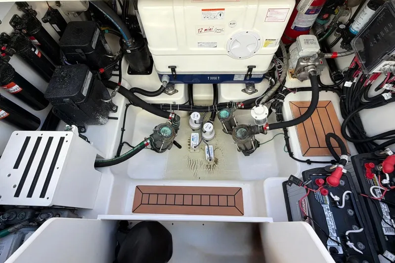  Yacht Photos Pics Engine room of 2022 Boston Whaler 405 Conquest, showcasing mechanical components and wiring.
