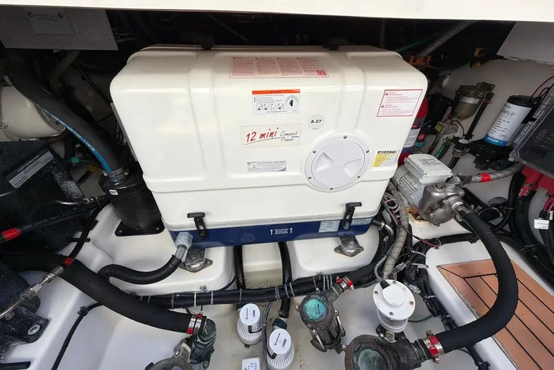  Yacht Photos Pics Engine compartment of a 2022 Boston Whaler 405 Conquest boat, showcasing mechanical components.