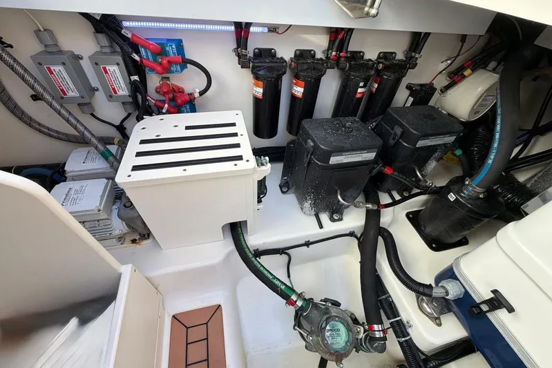  Yacht Photos Pics Engine compartment of 2022 Boston Whaler 405 Conquest, showcasing wiring and mechanical components.