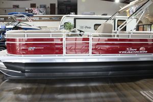 2025 Sun Tracker Party Barge 22 DLX pontoon boat in showroom.
