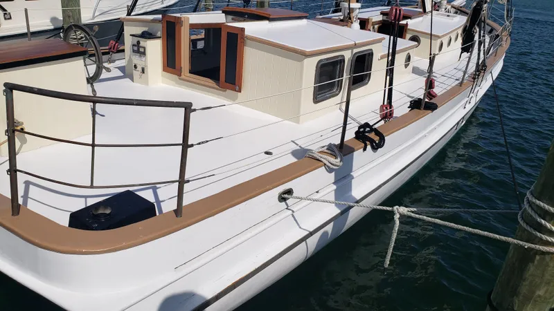 Daniel Webster Clements Yacht Photos Pics 1996 Custom Biloxi Schooner docked, showcasing deck and cabin details.