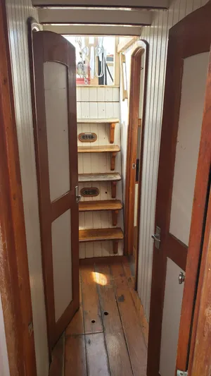 Daniel Webster Clements Yacht Photos Pics Interior of 1996 Custom Biloxi Schooner with wooden doors and steps.