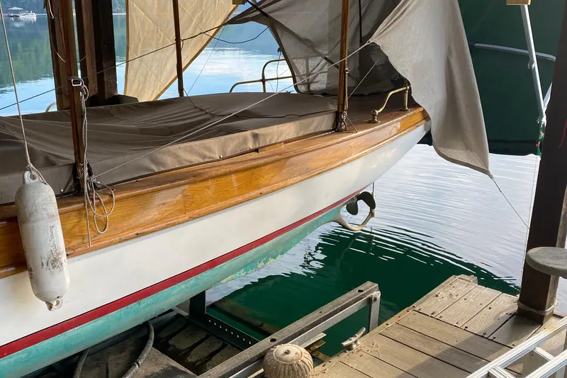 Annie Yacht Photos Pics Elco 30 Fantail Electric Launch, 1989, docked with wooden detailing and protective cover.