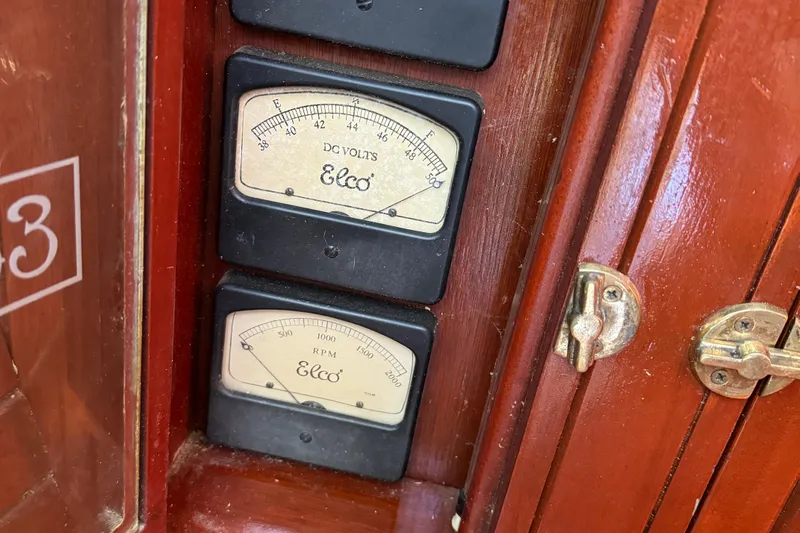 Annie Yacht Photos Pics Close-up of Elco 30 Fantail Electric Launch 1989 volt and RPM gauges.