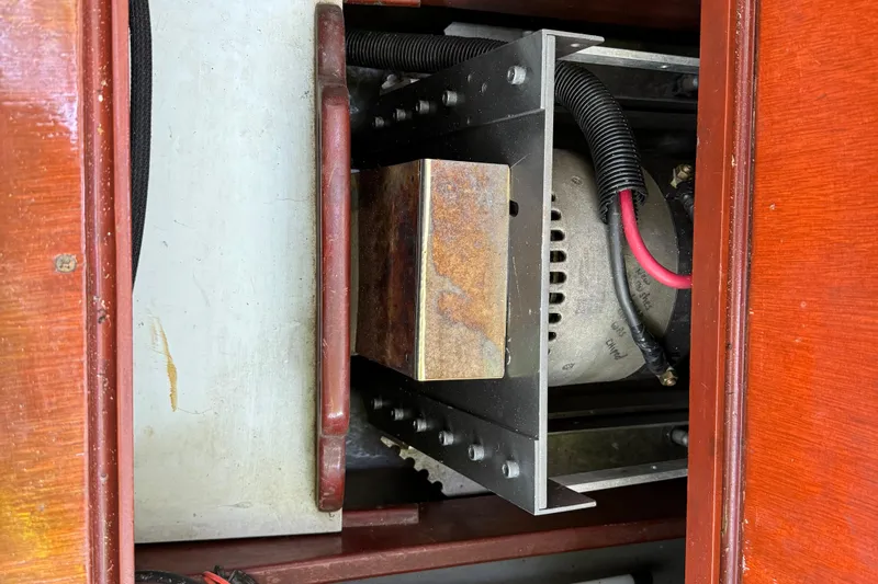 Annie Yacht Photos Pics Electric motor compartment of 1989 Elco 30 Fantail Electric Launch, featuring wiring and metal components.