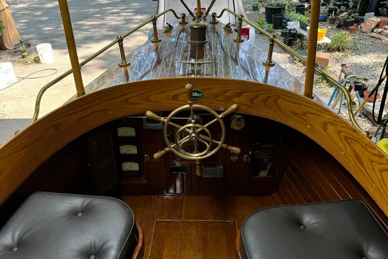 Annie Yacht Photos Pics Interior view of 1989 Elco 30 Fantail Electric Launch with wooden steering wheel.