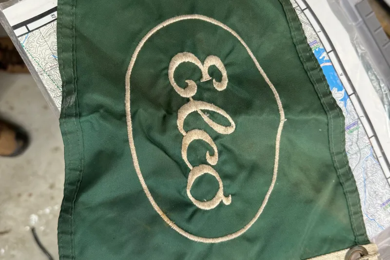 Annie Yacht Photos Pics Green Elco flag with embroidered logo, representing the 1989 Elco 30 Fantail Electric Launch.