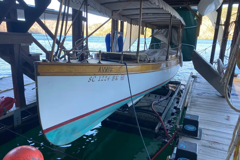 Annie Yacht Photos Pics Elco 30 Fantail Electric Launch 1989 docked, featuring classic design and wooden accents.